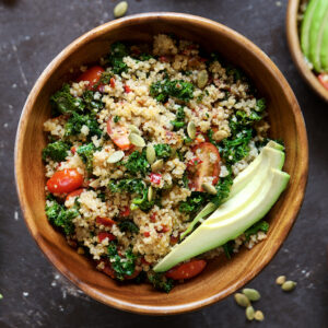 Quinoa salad with kale, cherry tomatoes and pumpkin seeds